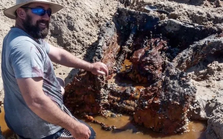A Queensland couple uncovered a buried 1930s Austin on their anniversary beach walk, a pre-WWII time capsule swallowed by sand for 90 years