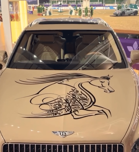 Artist performs live calligraphy on a $200K Bentley Bentayga at a Qatar festival