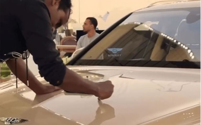 Artist performs live calligraphy on a $200K Bentley Bentayga at a Qatar festival