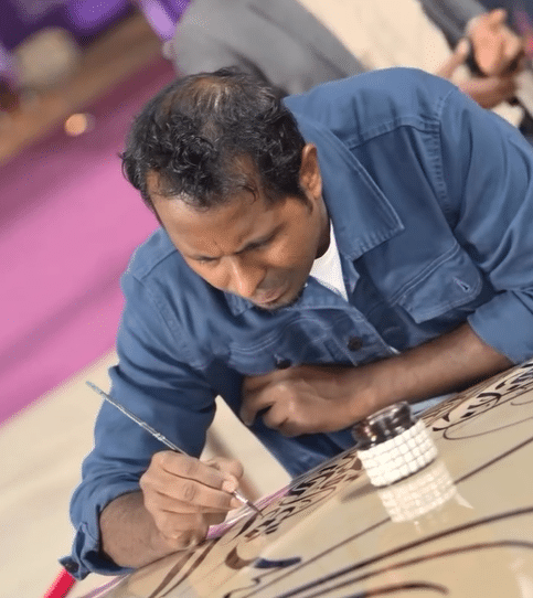 Artist performs live calligraphy on a $200K Bentley Bentayga at a Qatar festival