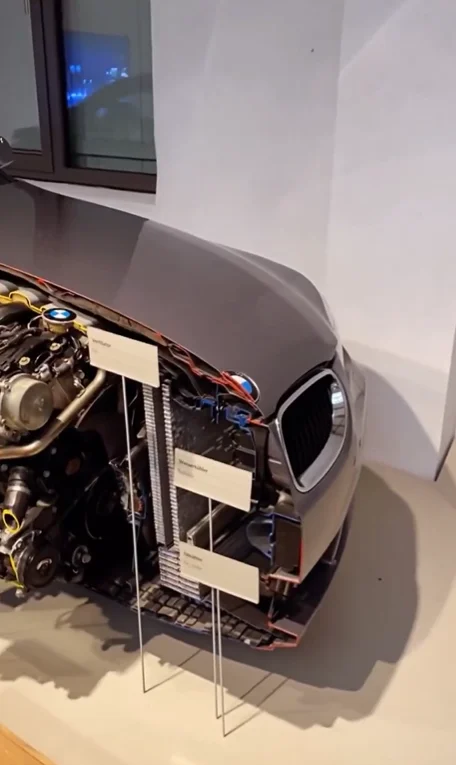 A BMW sliced in half exposes every hidden system from engine to airbags in a stunning display of precision engineering called Lehrschnittfahrzeug
