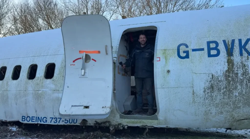 A YouTuber bought a retired Boeing 737 and is burying it underground to turn it into a bunker, revealing what the stripped-out interior really looks like