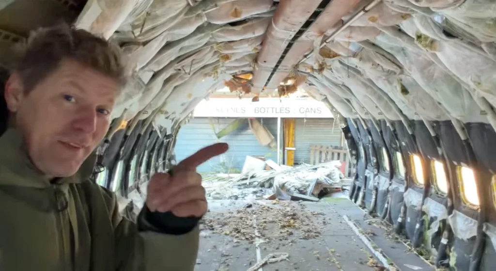 A YouTuber bought a retired Boeing 737 and is burying it underground to turn it into a bunker, revealing what the stripped-out interior really looks like