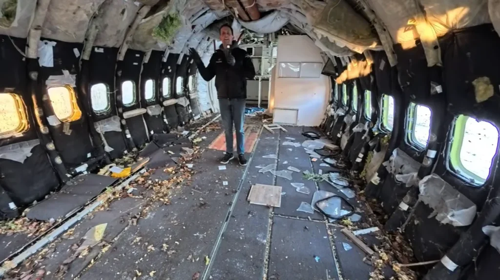 A YouTuber bought a retired Boeing 737 and is burying it underground to turn it into a bunker, revealing what the stripped-out interior really looks like