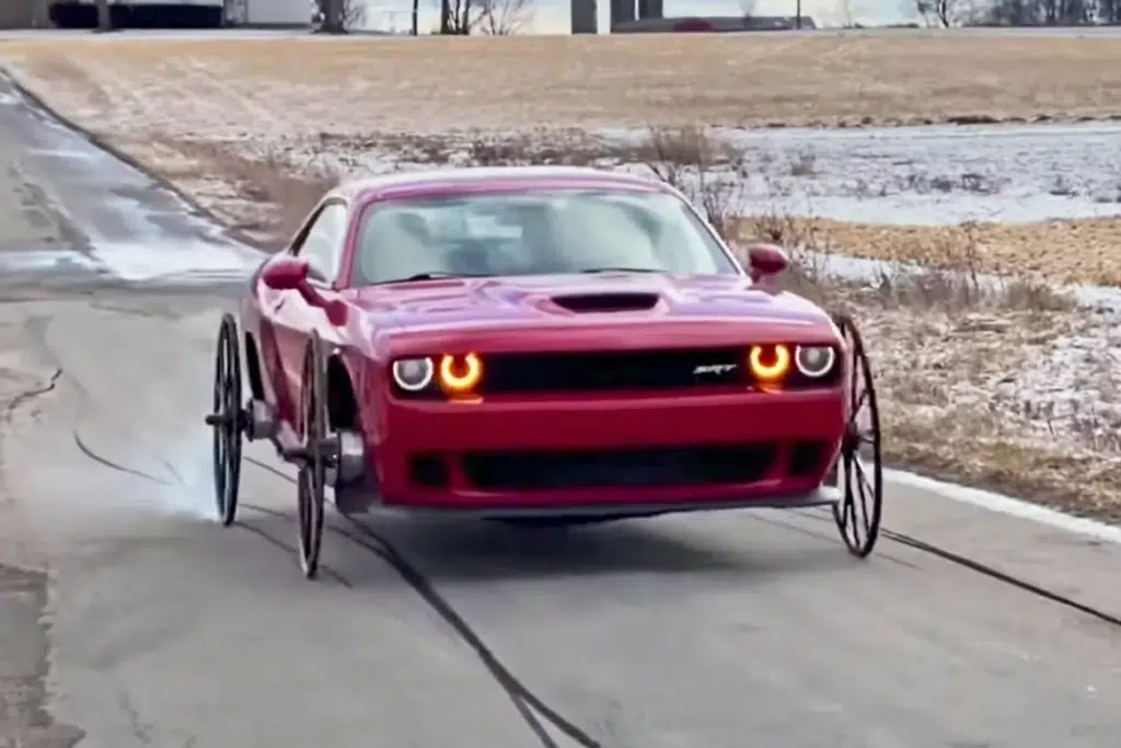 Man puts horse and carriage wheels on dodge
