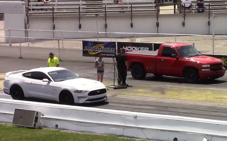 Chevy Silverado and Mustang drag race