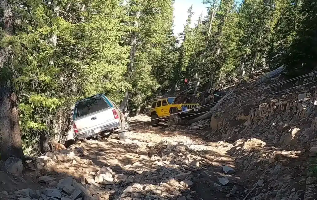 stuck Chevy Silverado pickup truck rescued from off-roading mountain