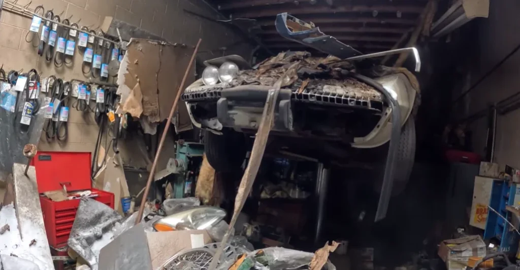 Chevy Corvette sitting on a lift for 50 years in an abandoned building is frozen in time with an unbelievable secret