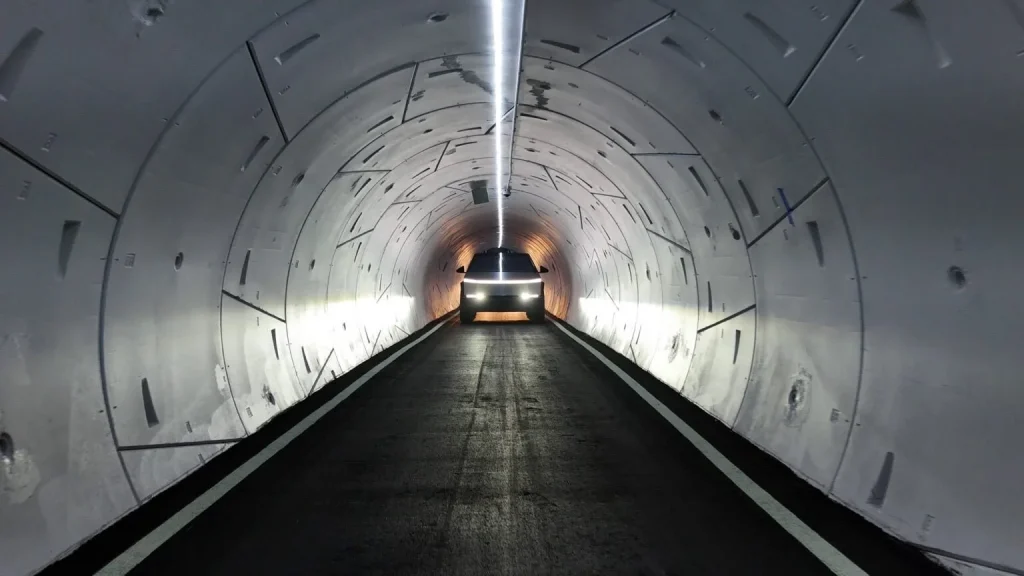 A Gigafactory Cybertruck birthing tunnel where each EV zooms out after being constructed at Tesla's Texas Gigafactory