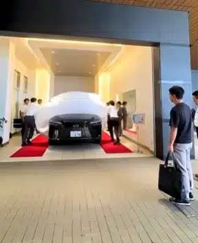 When you buy a Lexus in Japan, the delivery day plays out like a movie scene - bows, music, and a dramatic car reveal that feels more ritual than sale