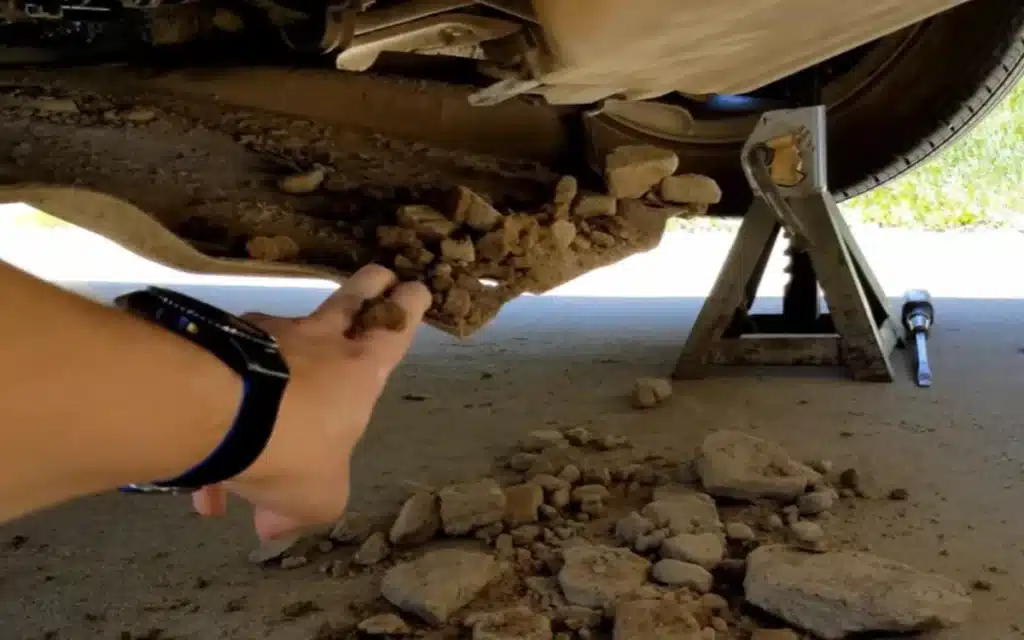 A Michigan YouTuber opened up his Tesla Model 3 after 36,000 miles and uncovered over 32 pounds of packed dirt hidden inside the car’s panels