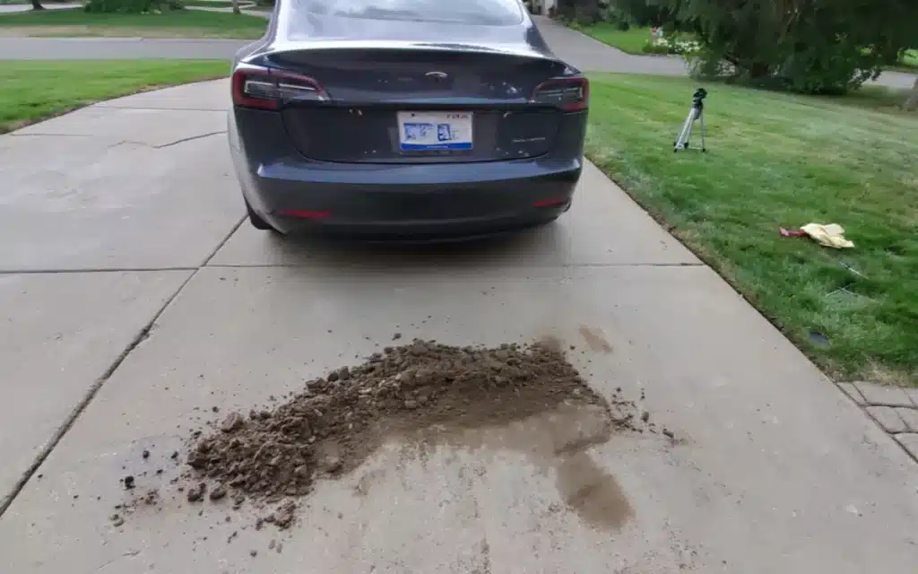 A Michigan YouTuber opened up his Tesla Model 3 after 36,000 miles and uncovered over 32 pounds of packed dirt hidden inside the car’s panels