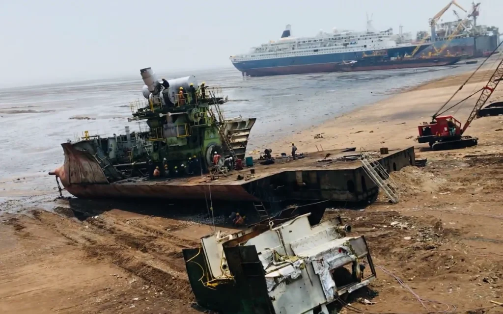 The Alang Ship Breaking Yard in Gujarat, India, is the world's largest ship graveyard, a sprawling coastal zone where the world's retired vessels meet their end.