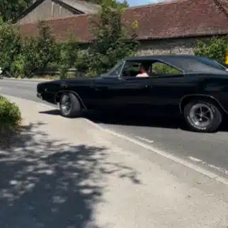 A classic American car, the Dodge Charger, has gone viral after struggling with a tight UK corner, sparking debate whether driver or design is to blame