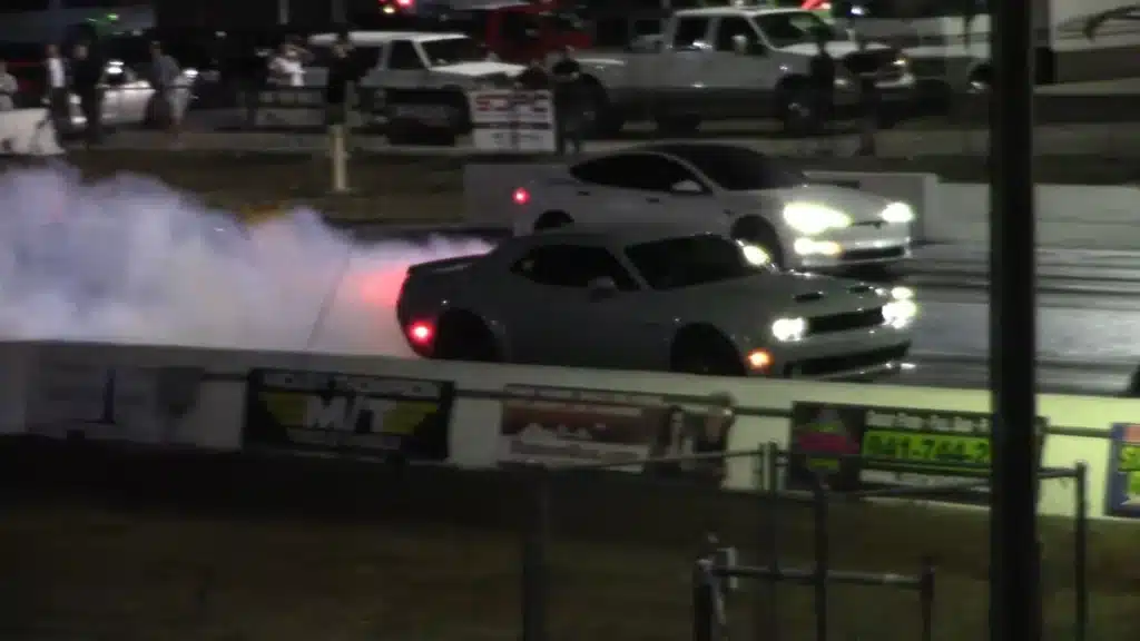 Dodge Hellcat drag race versus Tesla Plaid with clear winner