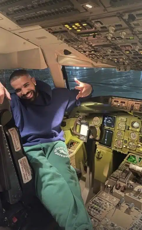 Drake in the cockpit of his private jet 