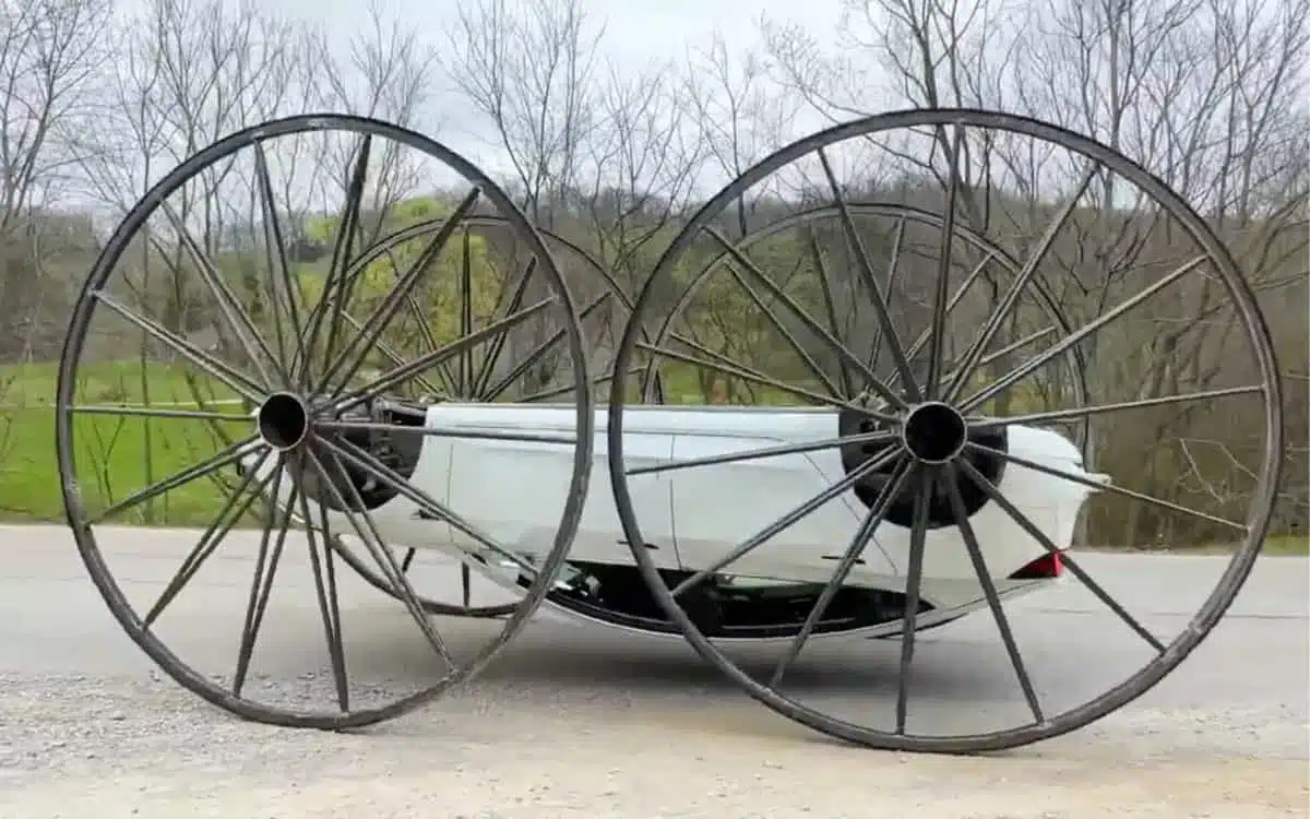 YouTuber attaches 10-foot wheels to his Tesla and drives it upside down