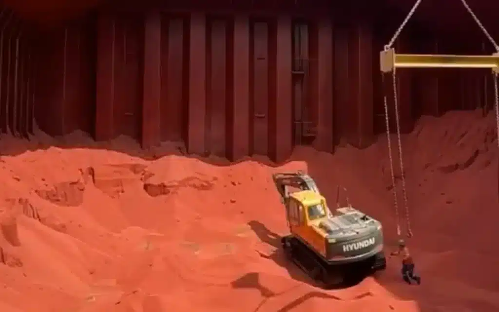 Footage showing an excavator being lowered into a cargo ship to help during the unloading process has left social media users in disbelief