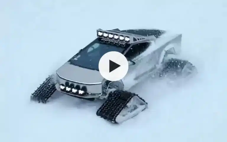 Customized Cybertruck plows through snow with crazy track wheels