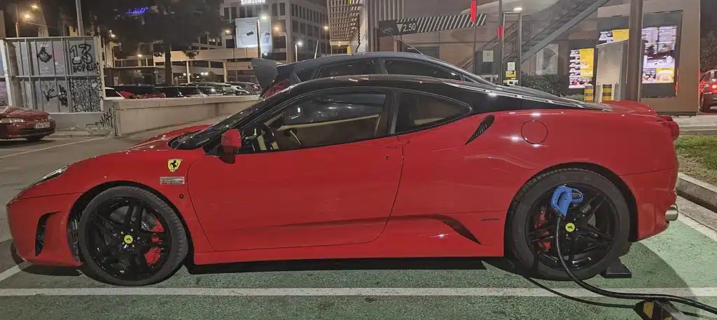 Ferrari F430 at EV charging spot in Greece