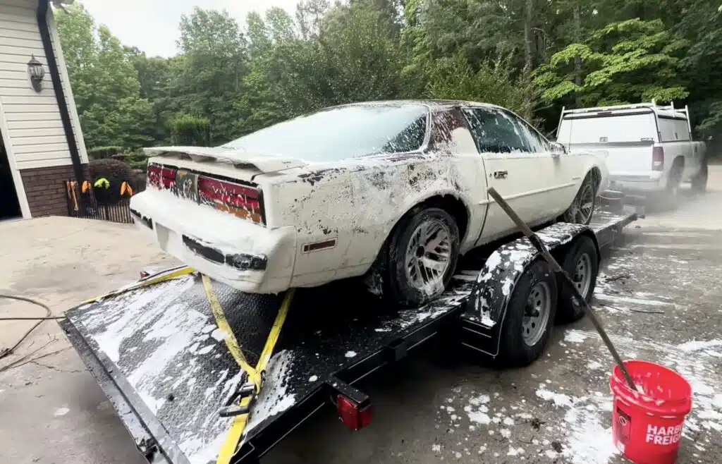 American man pulls abandoned 1987 Pontiac Firebird out of the woods and sees if he can get it to run