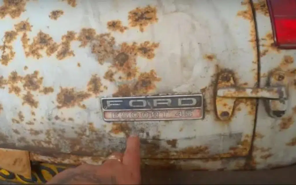 Urban explorer uncovers ultra-rare Ford Escort in a car graveyard filled with abandoned vehicles