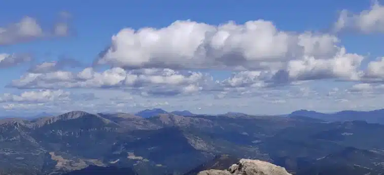 Man baffled after spotting plane zooming past him near mountains while he was hiking in valley