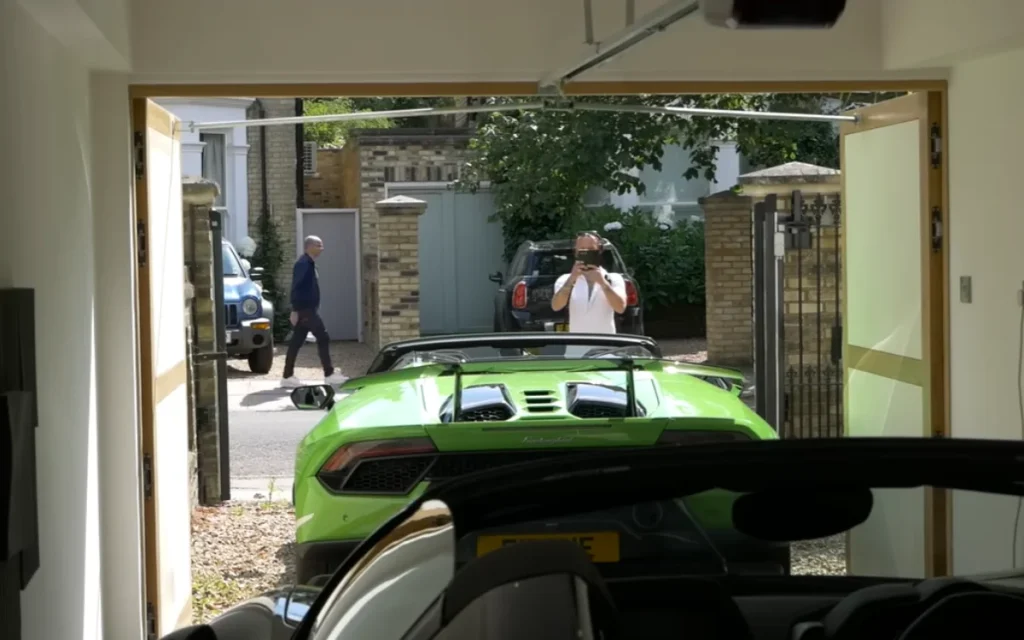 A YouTuber opens his garage to reveal a Lamborghini Huracán Performante and Ferrari 458 Speciale Aperta, sparking priceless reactions from passersby