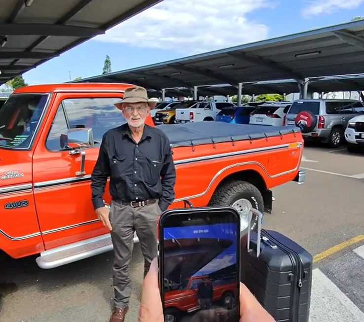 A son surprised his dad with a 1970s Ford F-150 in an emotional reveal at Townsville Airport that turned their journey home into a father-son road trip