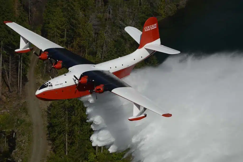 Incredible flying boat scoops water from lake