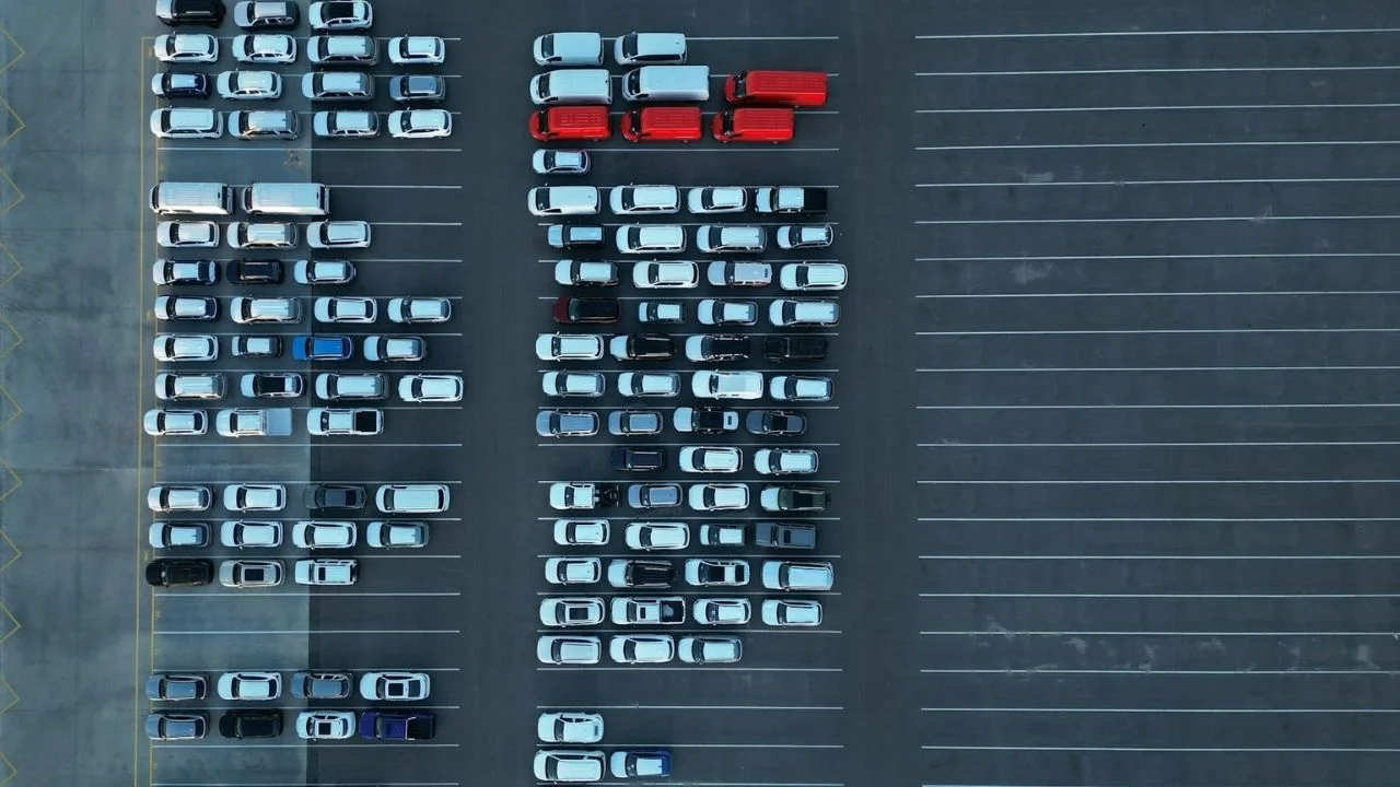 A car salesman reveals the hidden costs of vehicles sitting idle in yards or depots