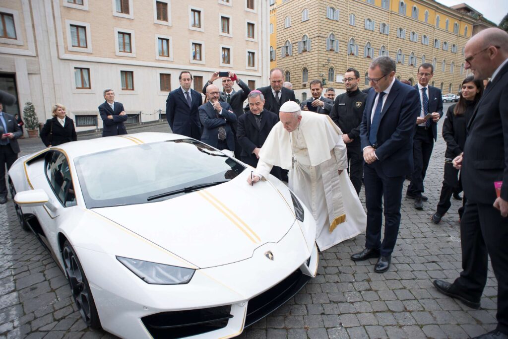 Francis signed the brand new Lamborghini Huracan - before sending it for auction.