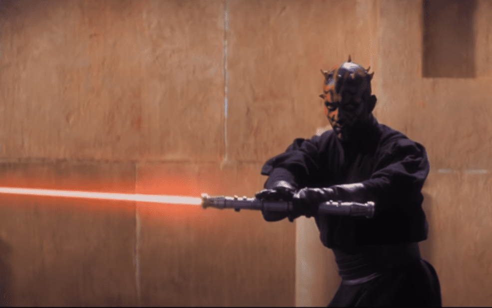 Darth Maul with his lightsaber drawn.