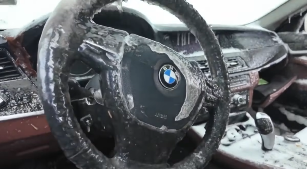 Abandoned BMW turns into a tourist destination after being battered by ice and wind for days