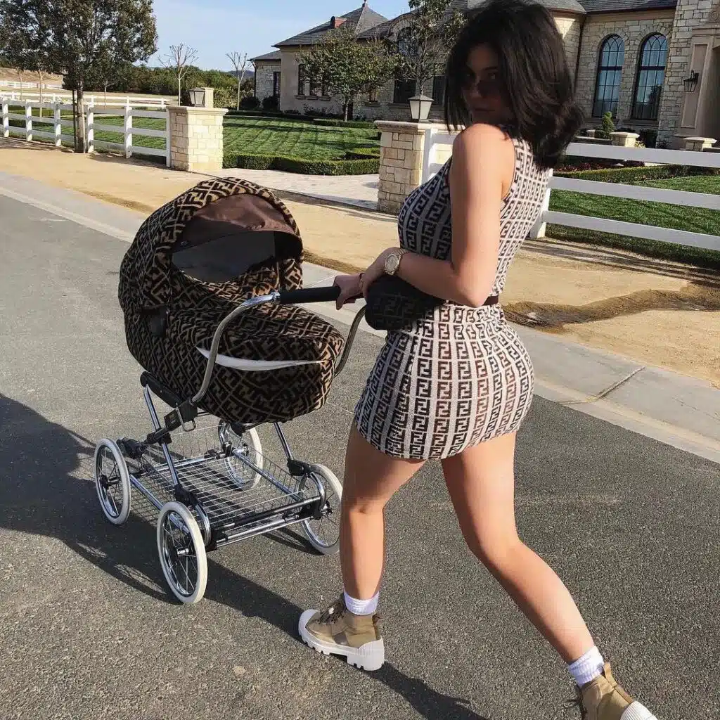 Kylie takes baby Stormi for a walk in a Fendi stroller