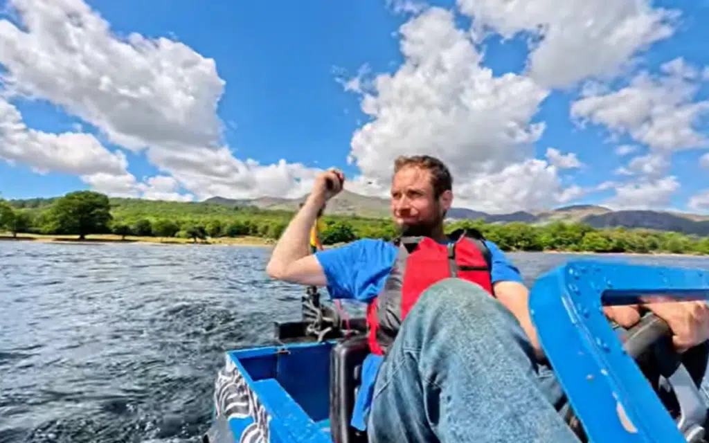 English dad transforms his sons mini Land Rover into an amphibian machine and drives it across a lake