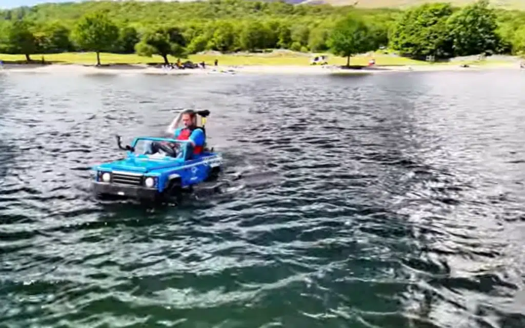 English dad transforms his sons mini Land Rover into an amphibious vehicle and drives it across a lake