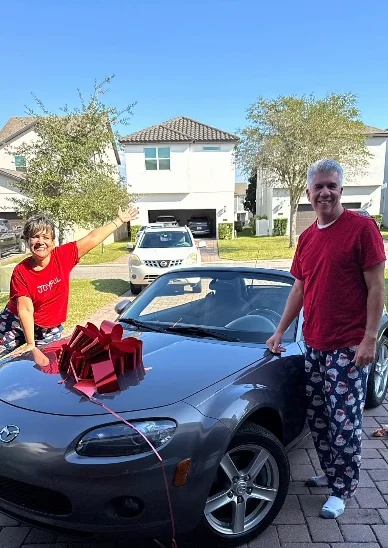 Parents break down in tears after kids surprise them with their dream car to say thank you