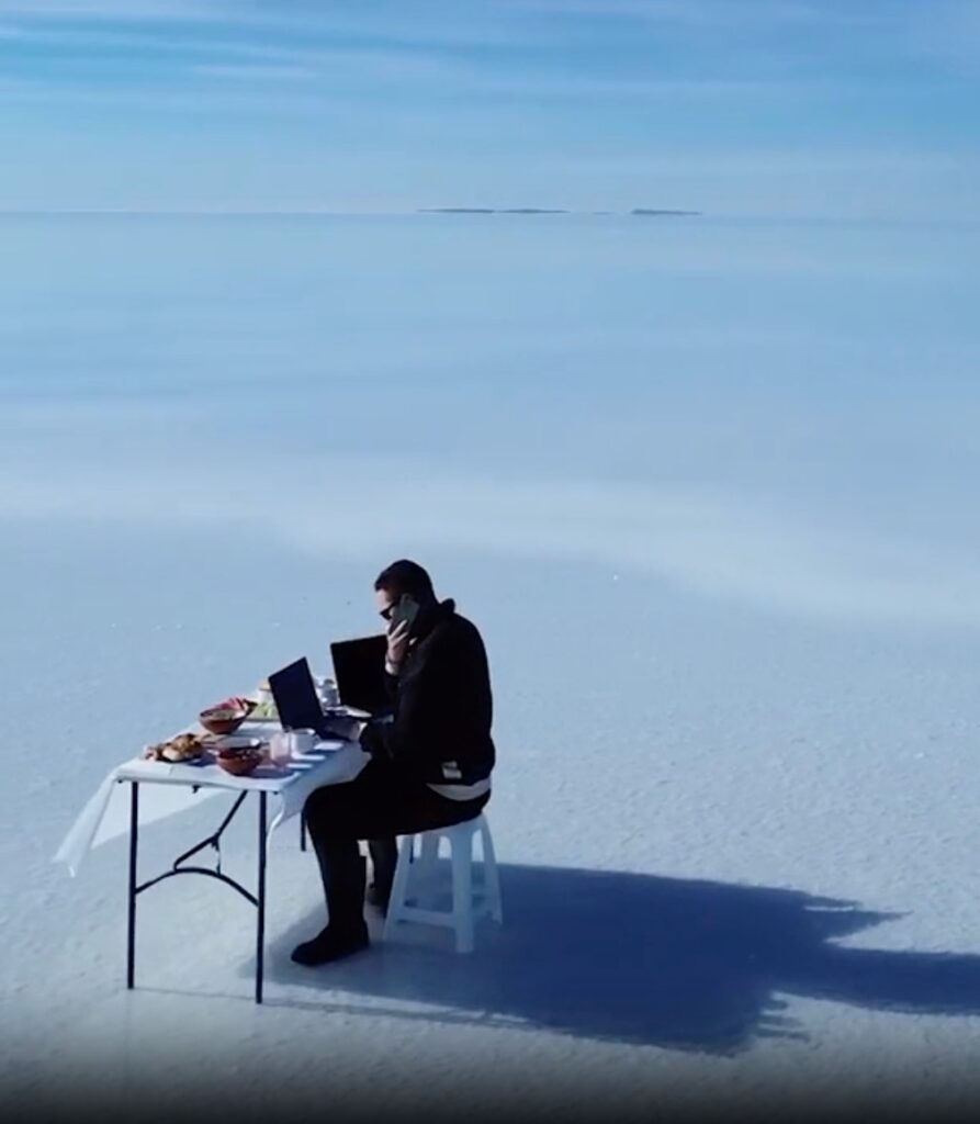 stock trader trading on a beach