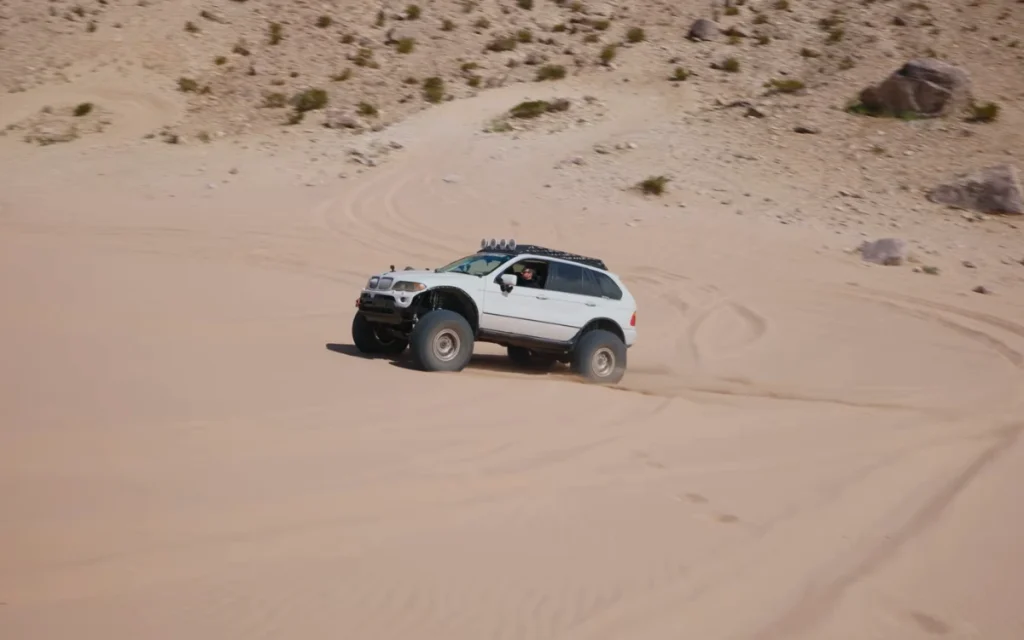 This heavily modified off-roader had once been just a regular BMW X5, the kind you’d expect to see doing school runs rather than climbing rocks.