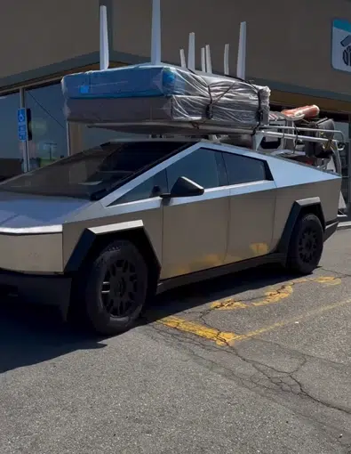 Tesla Cybertruck owner needed to move so loaded entire apartment onto truck's back