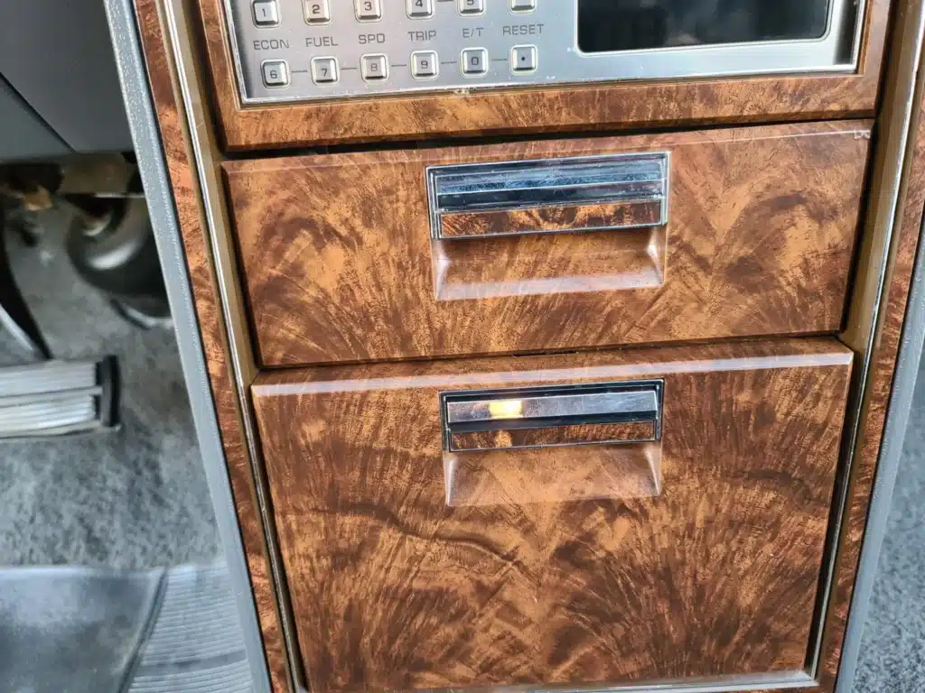 Check out the interior of this 1985 Chrysler New Yorker that’s decked out in fake wood and looks like the sort of thing you’d see in Patrick Bateman’s office