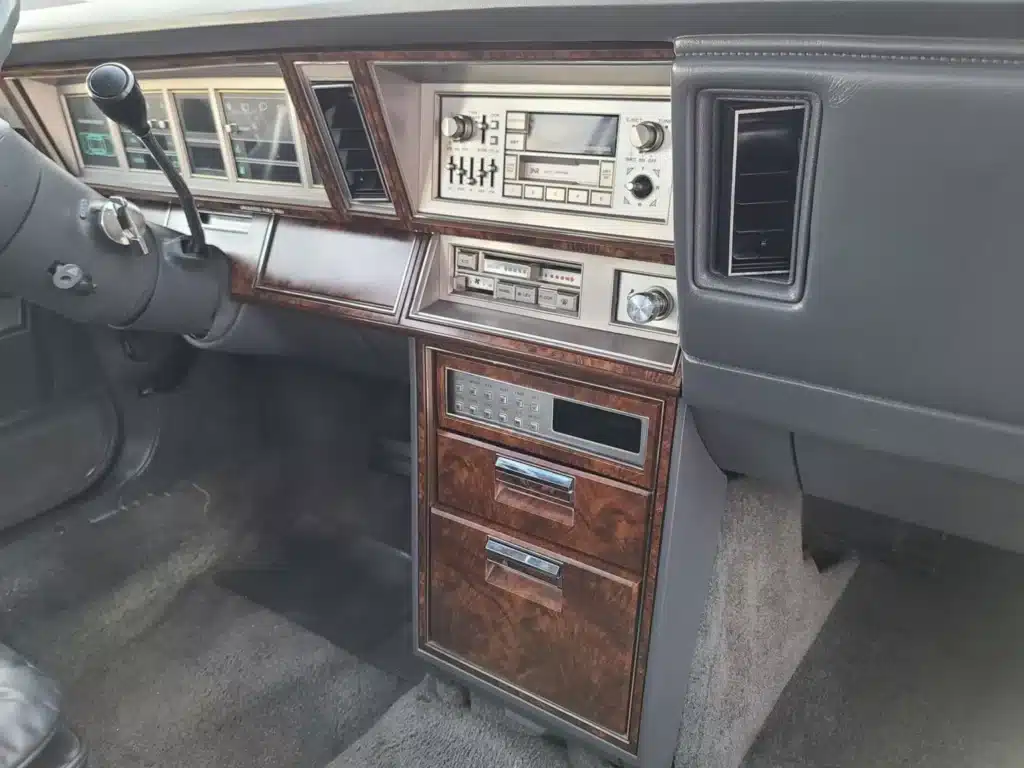 Check out the interior of this 1980s Chrysler New Yorker that’s decked out in fake wood and looks like the sort of thing you’d see in Patrick Bateman’s office