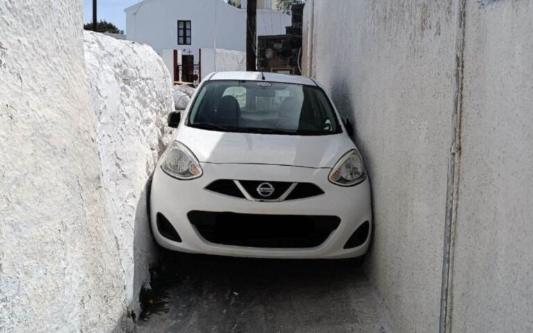 Nissan Micra wedged down alley in Mesaria, Santorini