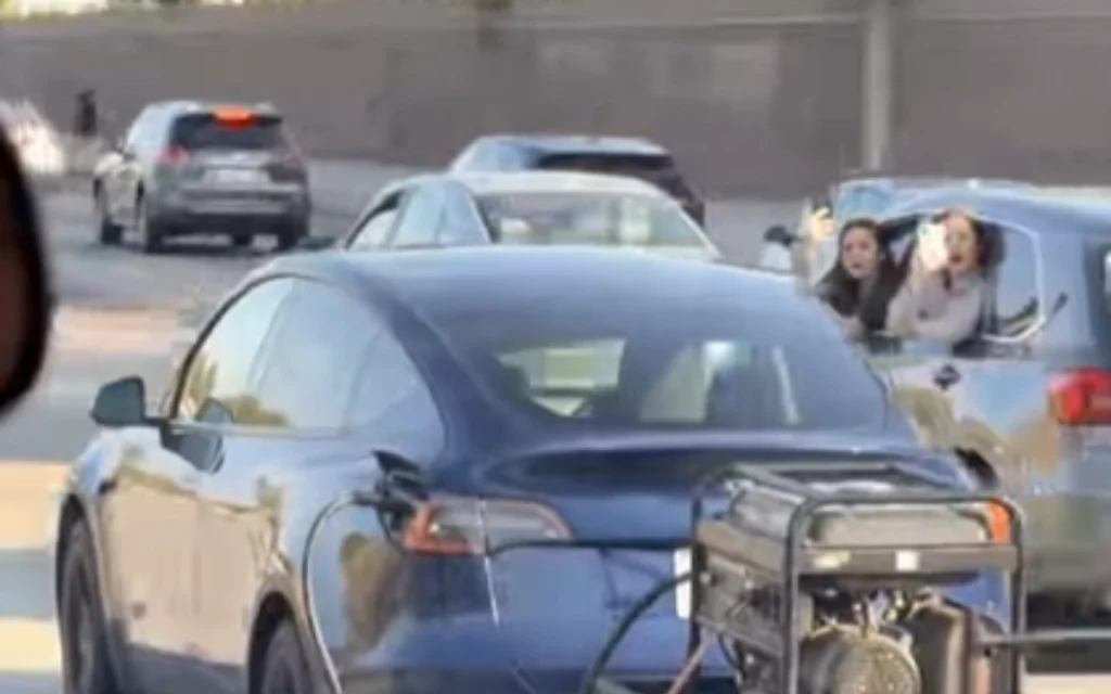 A viral clip showing what appeared to be a Tesla owner towing a generator behind his electric car quickly sparked a flood of jokes and discussions about range anxiety online.