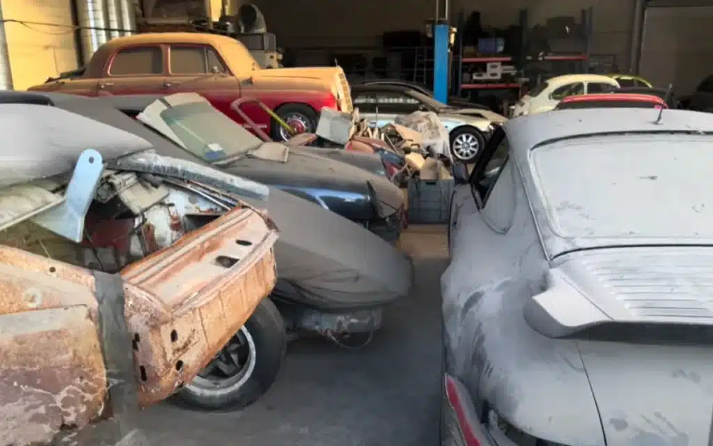 An urban explorer discovers an abandoned Porsche dealership in Belgium, where dusty 356s, a GT3 RS, and even a hidden DeLorean sit eerily frozen in time