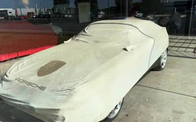 An urban explorer discovers an abandoned Porsche dealership in Belgium, where dusty 356s, a GT3 RS, and even a hidden DeLorean sit eerily frozen in time