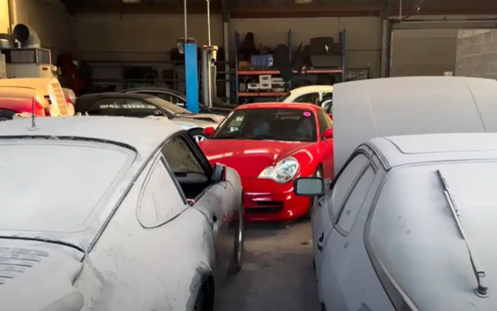 An urban explorer discovers an abandoned Porsche dealership in Belgium, where dusty 356s, a GT3 RS, and even a hidden DeLorean sit eerily frozen in time