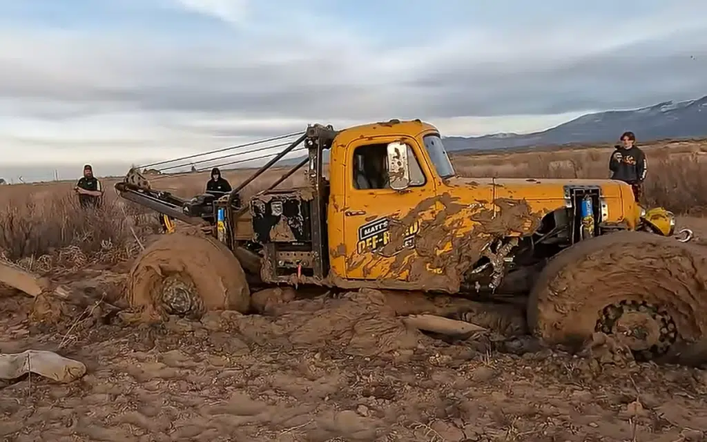 Vehicle recovery team in Utah try to rescue Dodge Durango stuck in mud lake but end up getting stuck themselves