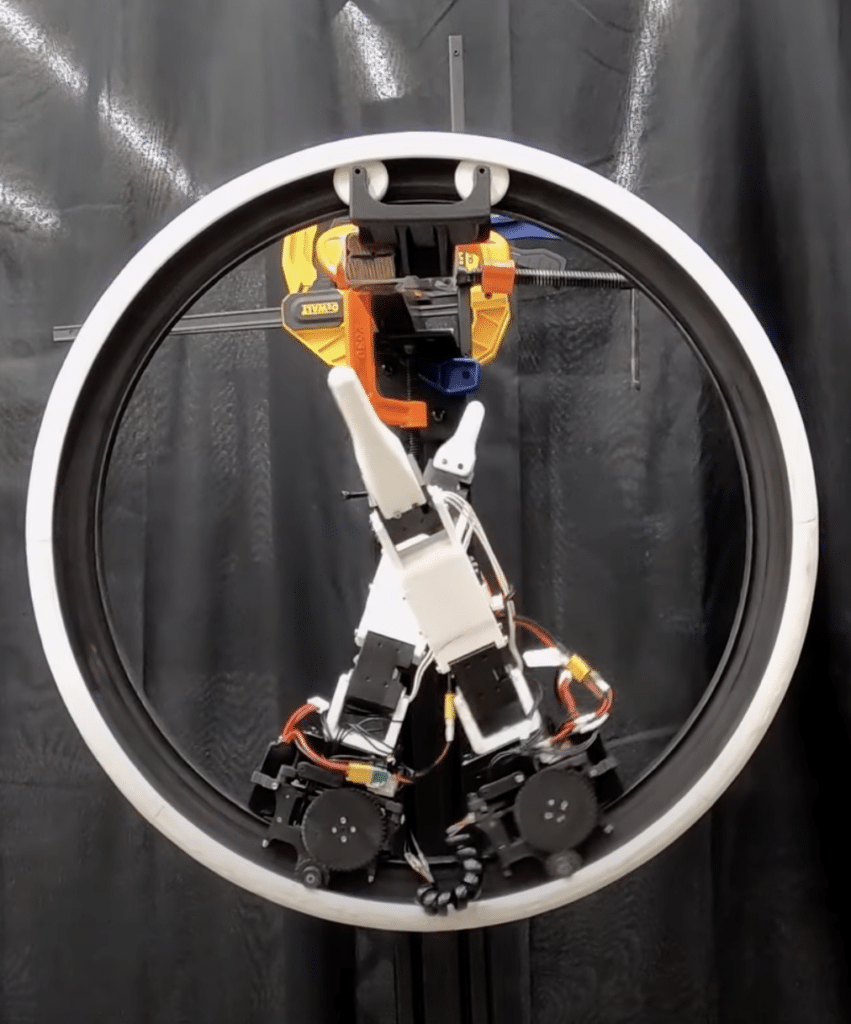 Fascinating 'Ringbot' monocycle robot rolls around and balances on two legs